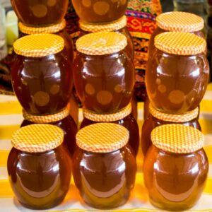 Glass jar of white honey
